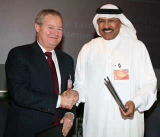Jim Mulva and Abdallah S. Jum'ah celebrate the signing of their companies' memorandum of understanding with the intent to build a 400,000-barrel-per-day refinery at Yanbu'. It was the second MOU of the week for Saudi Aramco.  Photo courtesy of Saudi Aramco